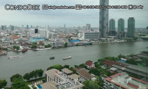 This 2-bedroom condo with a river view is available in a popular Baan Sathorn Chaopraya condominium near King Taksin Bridge and BTS Krung Thon Buri