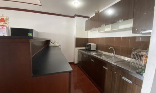 Cheap 2-bedroom Bangkok apartment for sale - large balcony - mid-floor - Monterey Place near MRT